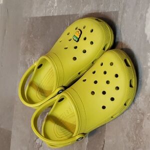Crocs Clogs. Yellow / light bright green. Women size 10. One charms.